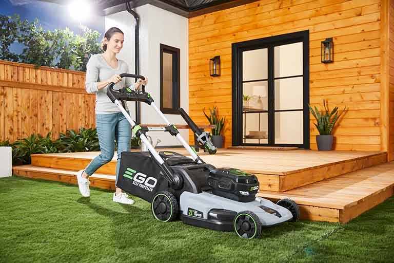 Woman using EGO lawn mower